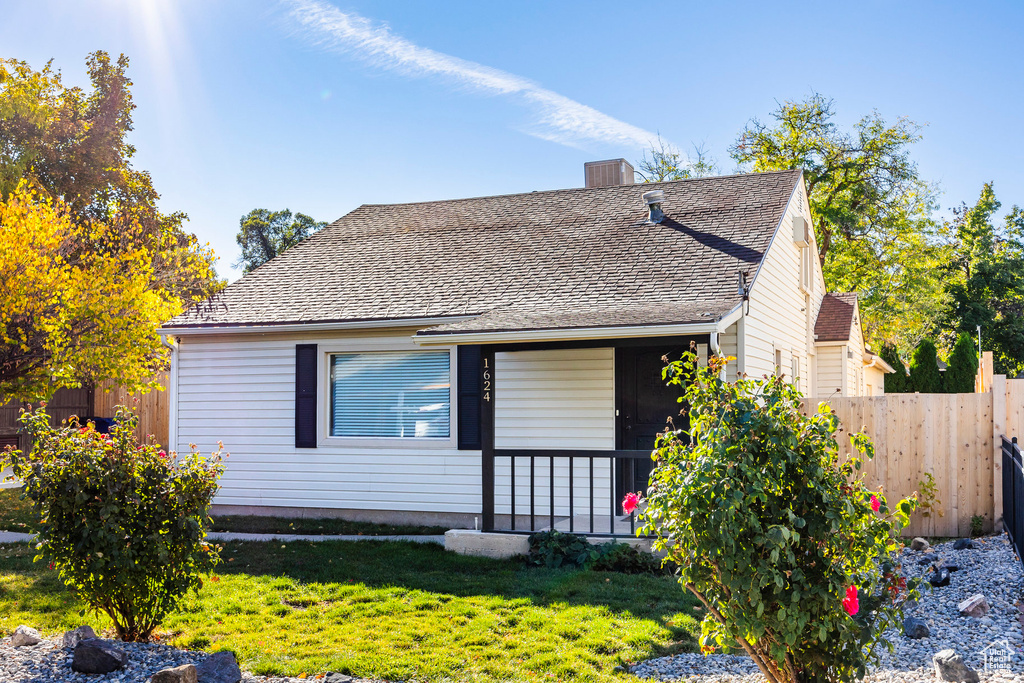 Bungalow-style house featuring a front lawn