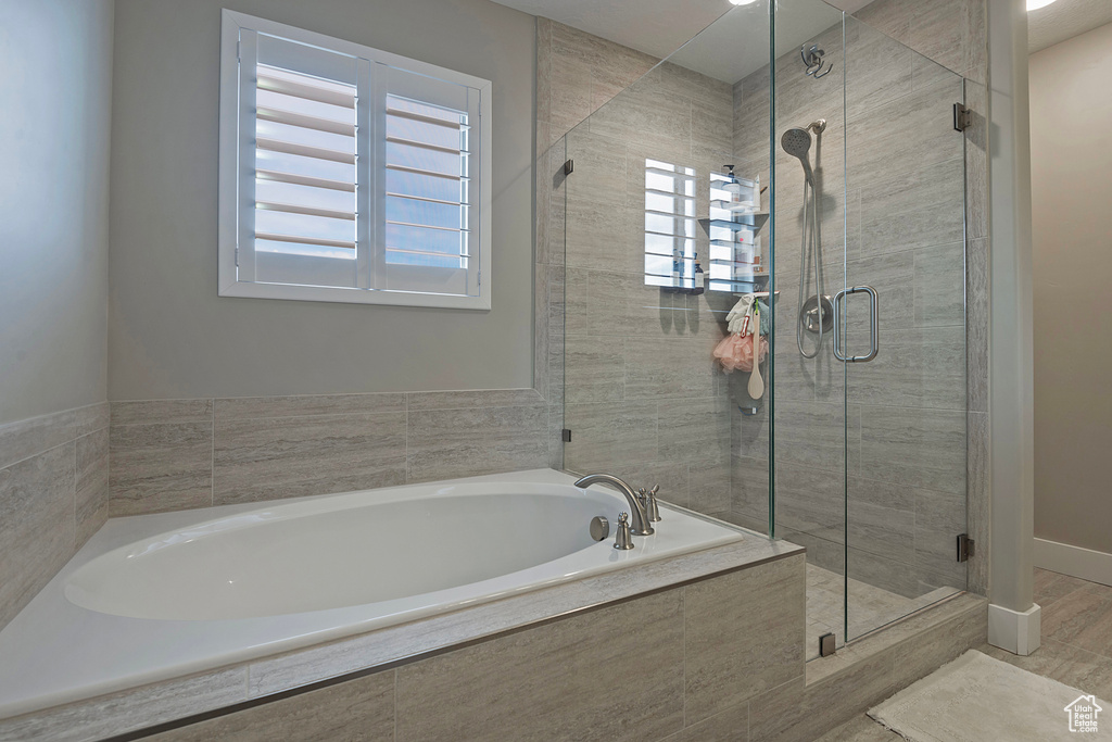 Bathroom featuring separate shower and tub