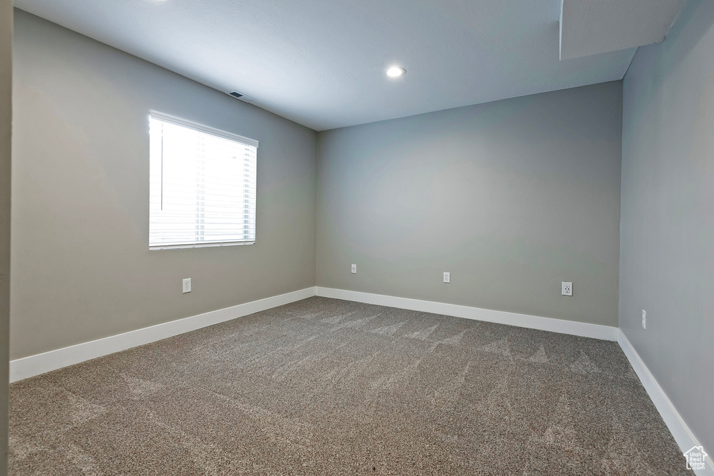 Empty room with carpet floors