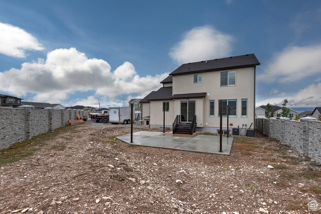 Back of property with a patio area