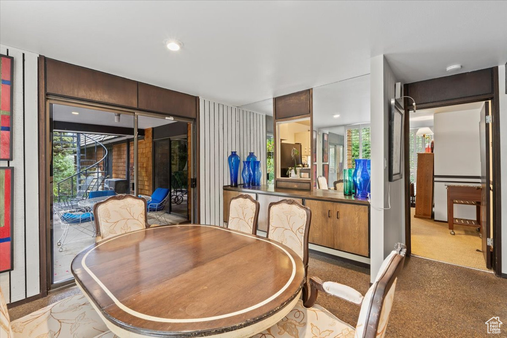 Dining area with light colored carpet