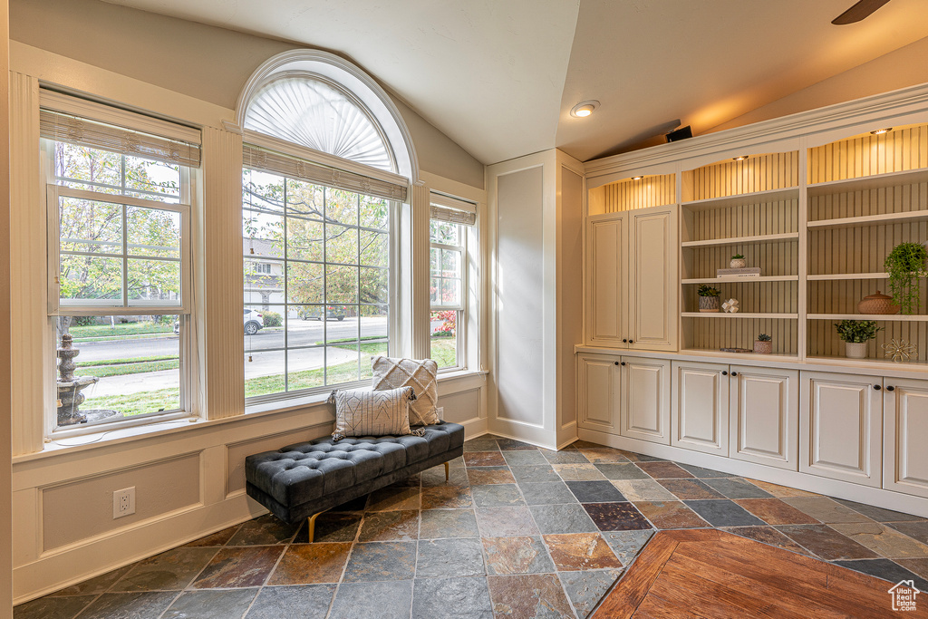 Sitting room featuring a wealth of natural light and vaulted ceiling