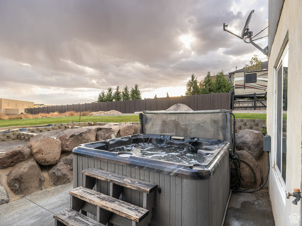 View of patio featuring a hot tub