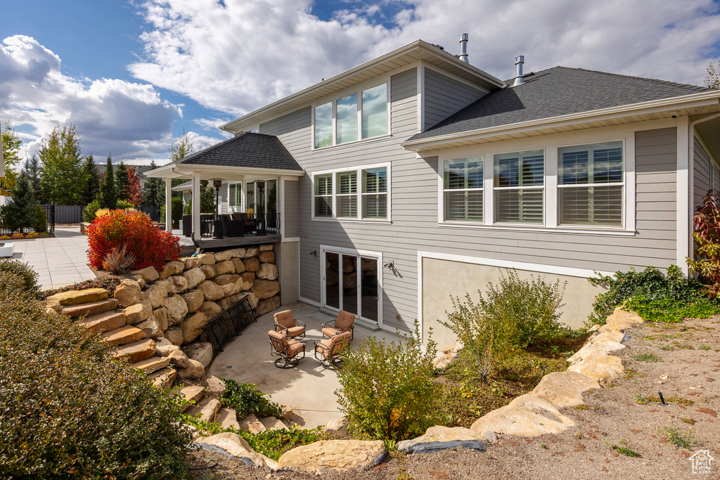 Rear view of property featuring a patio