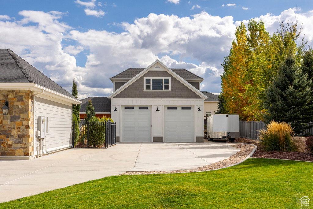 Garage featuring a yard