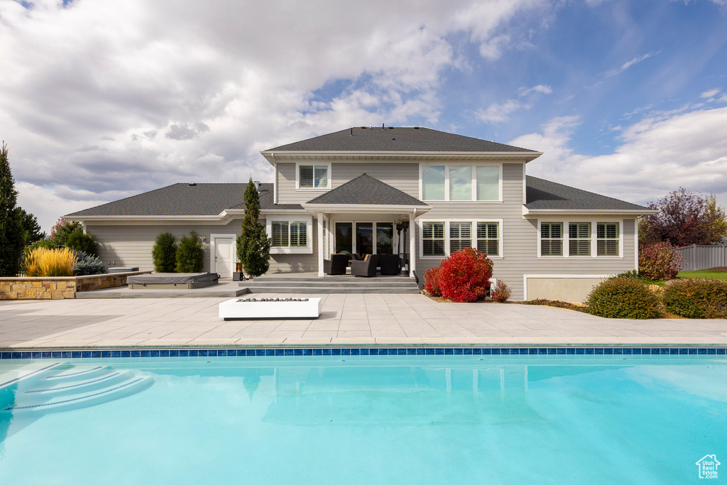 Rear view of house with a patio