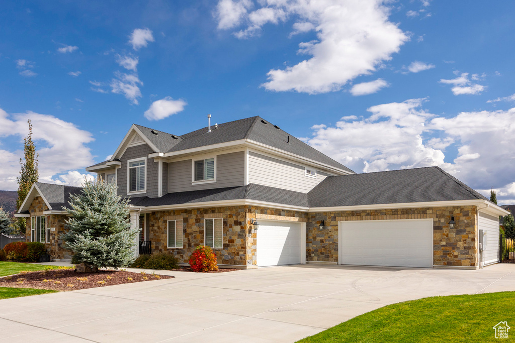 View of front of property with a garage