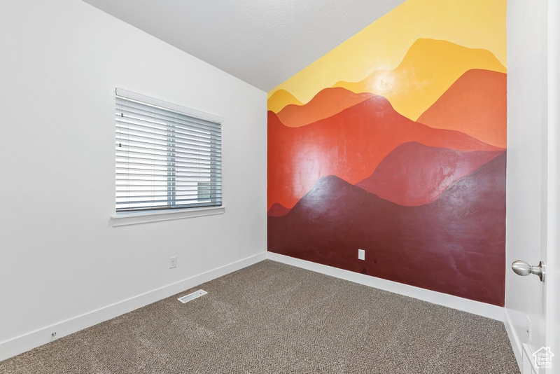 View of carpeted spare room