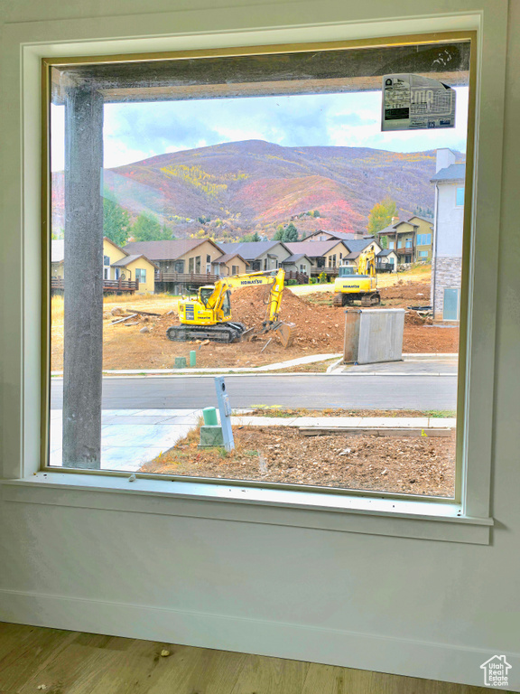 Details featuring a mountain view and wood-type flooring