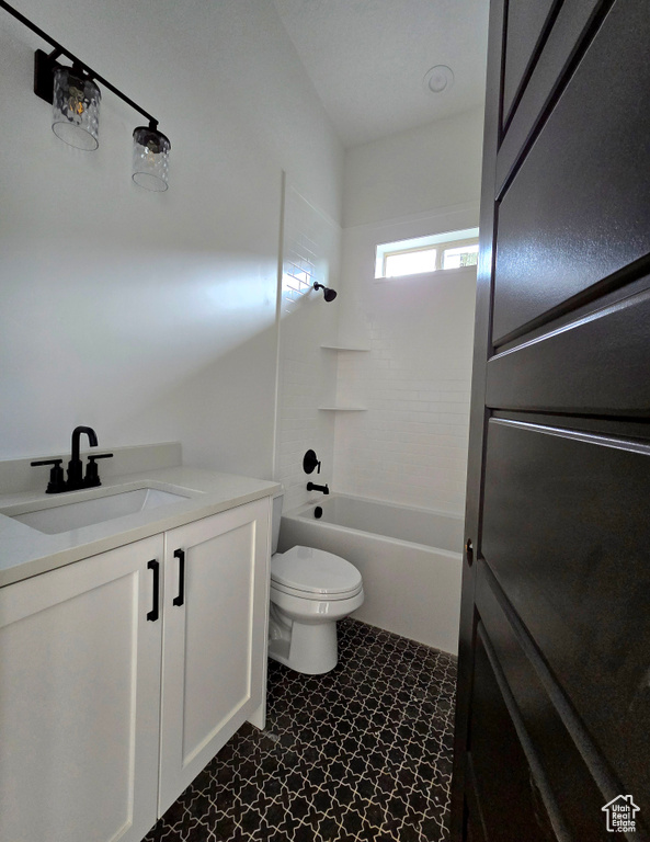 Full bathroom with vanity, toilet, and shower / bathtub combination