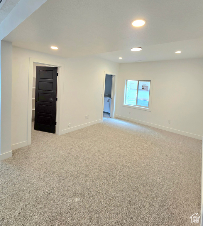 Unfurnished room with light colored carpet