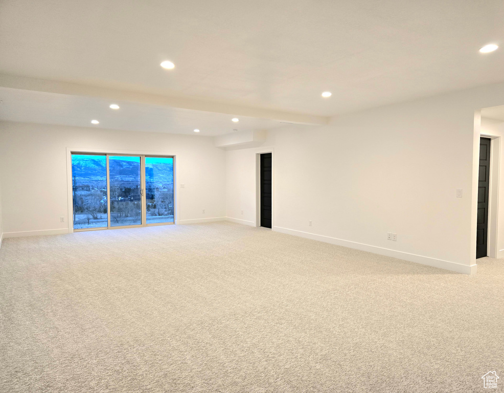 Spare room with light colored carpet