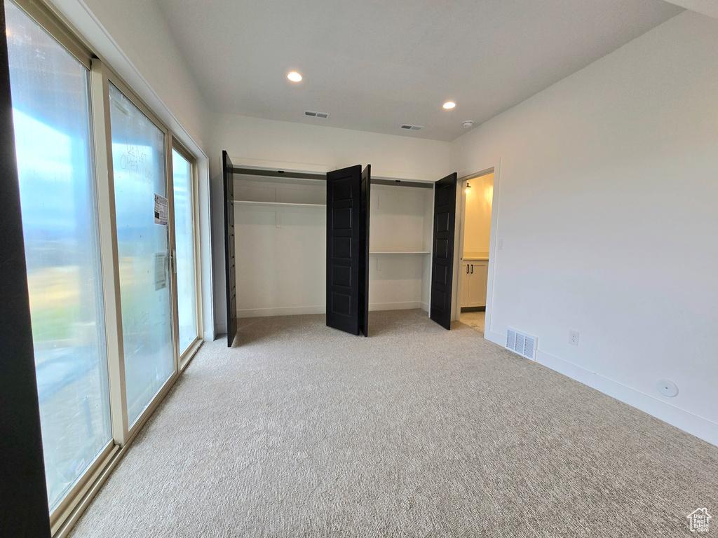 Unfurnished bedroom with carpet floors