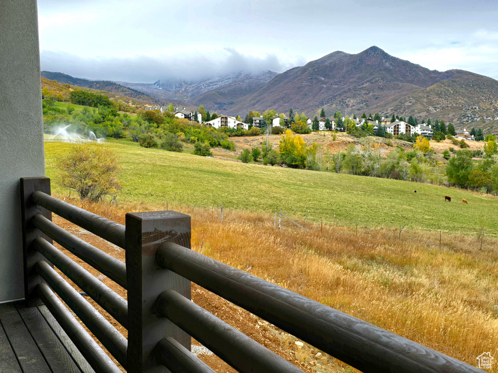 Property view of mountains with a water view