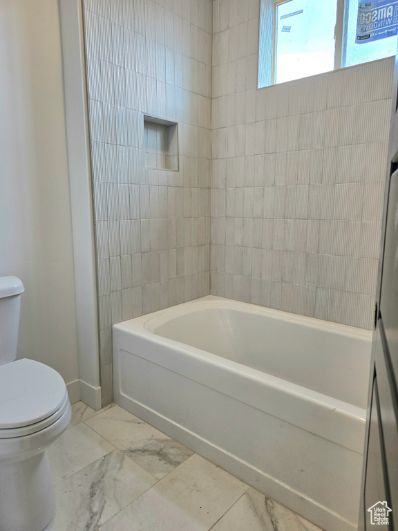 Bathroom with toilet and a tub