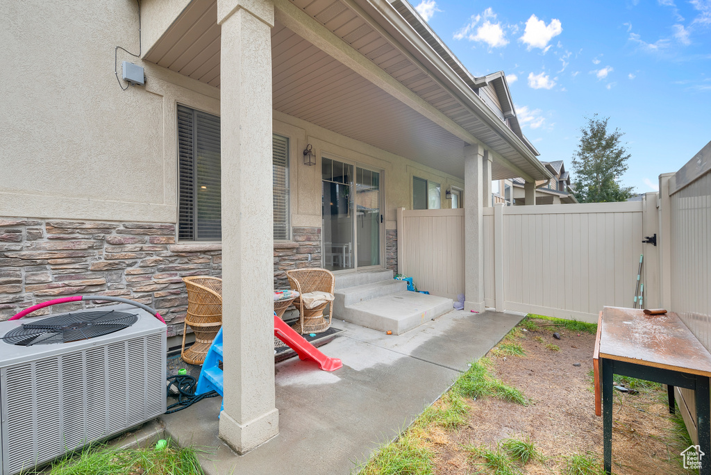 View of patio with central AC unit