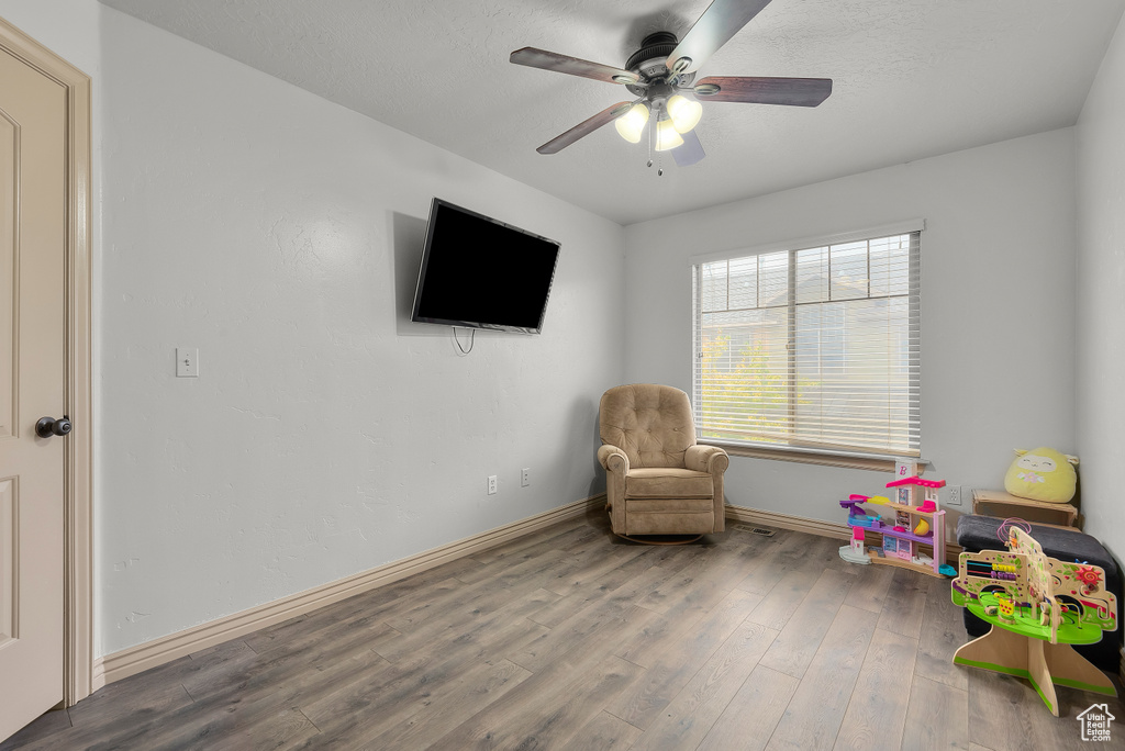 Rec room featuring ceiling fan and hardwood / wood-style flooring