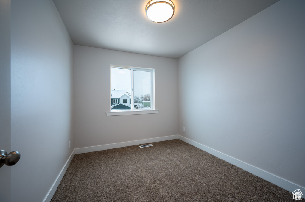 Empty room featuring carpet floors