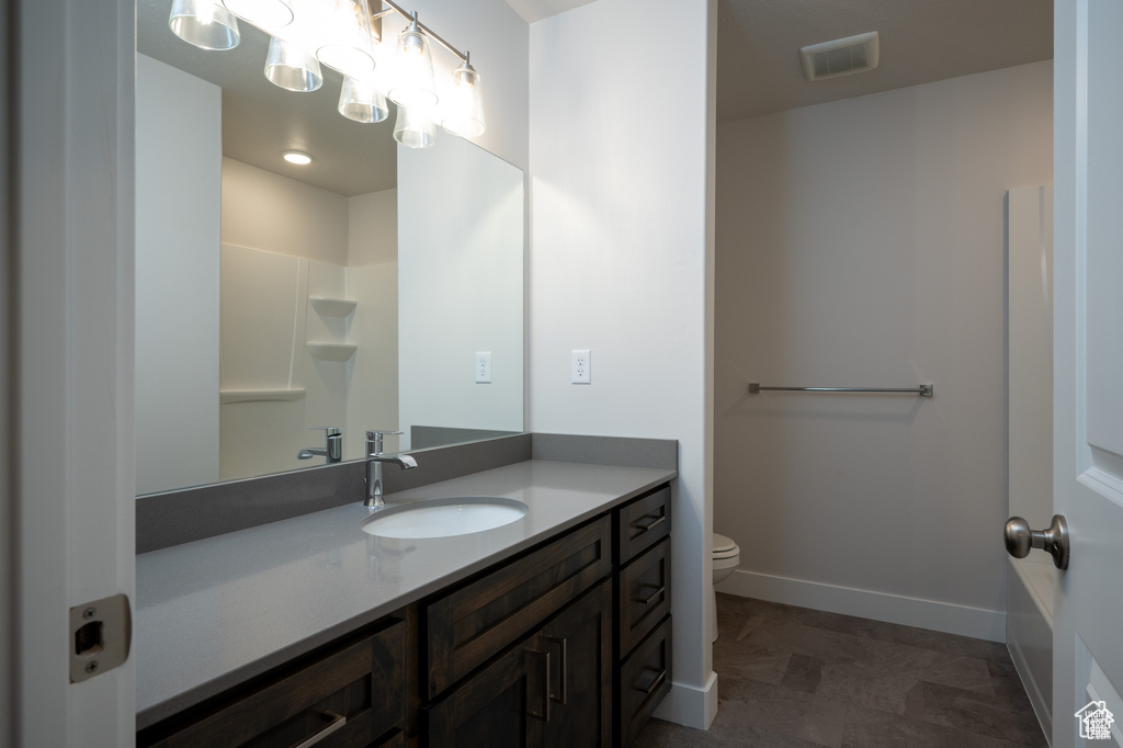 Bathroom with vanity and toilet