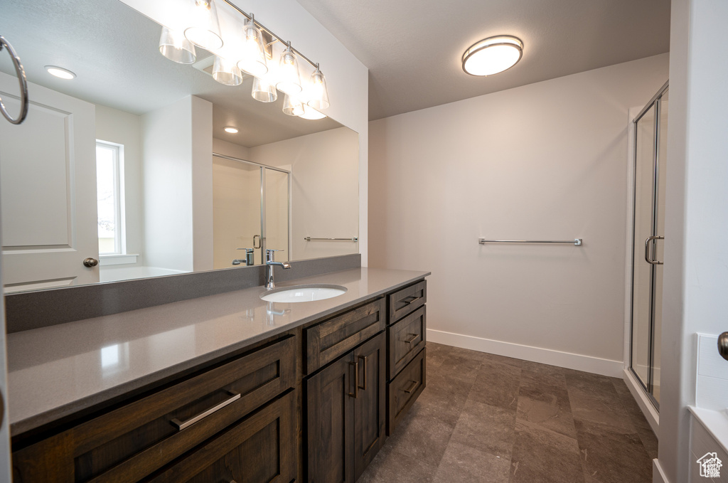 Bathroom with vanity and an enclosed shower