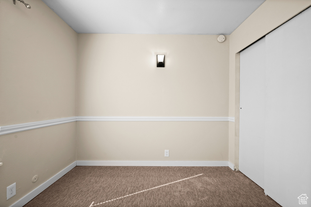 Unfurnished room with carpet floors