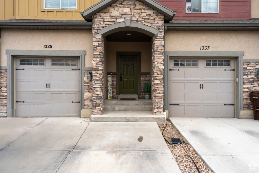 Entrance to property featuring a garage