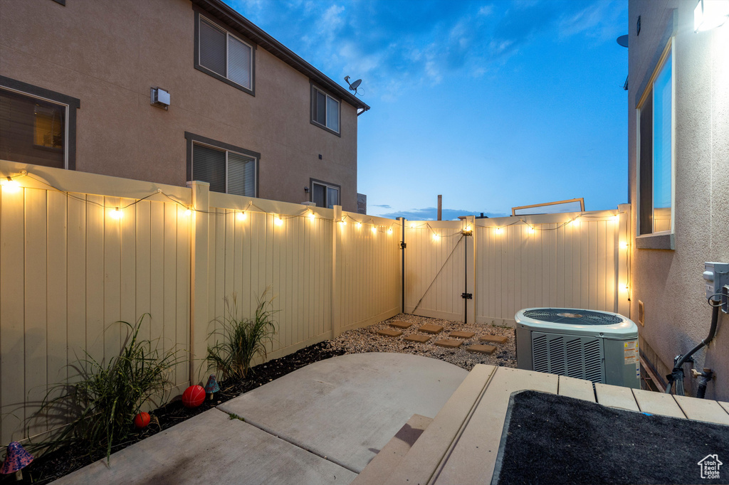 Patio terrace at dusk with central air condition unit