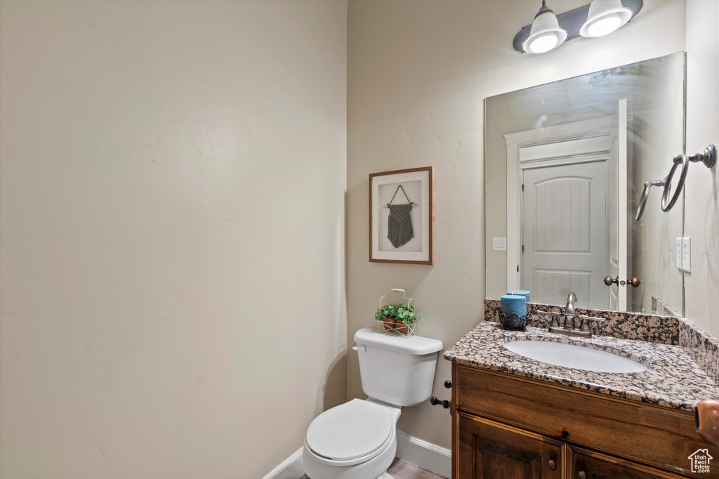 Bathroom featuring vanity and toilet