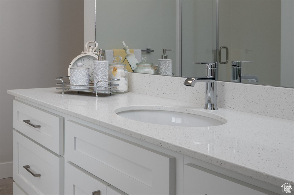 Bathroom featuring vanity and walk in shower