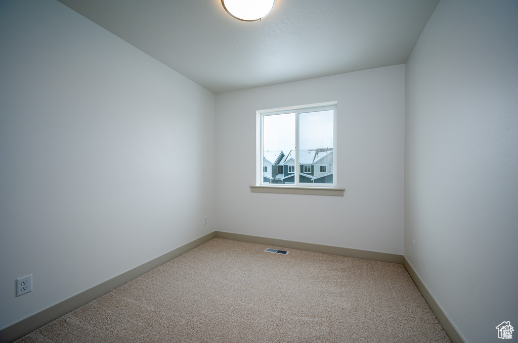 Unfurnished room featuring carpet flooring