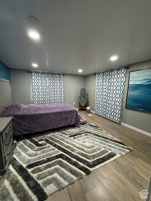 Bedroom featuring dark hardwood / wood-style floors