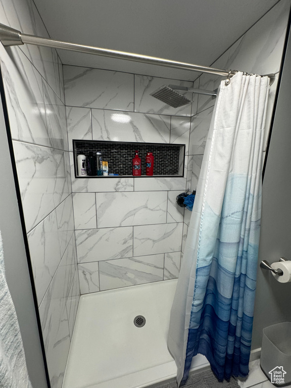 Bathroom with curtained shower