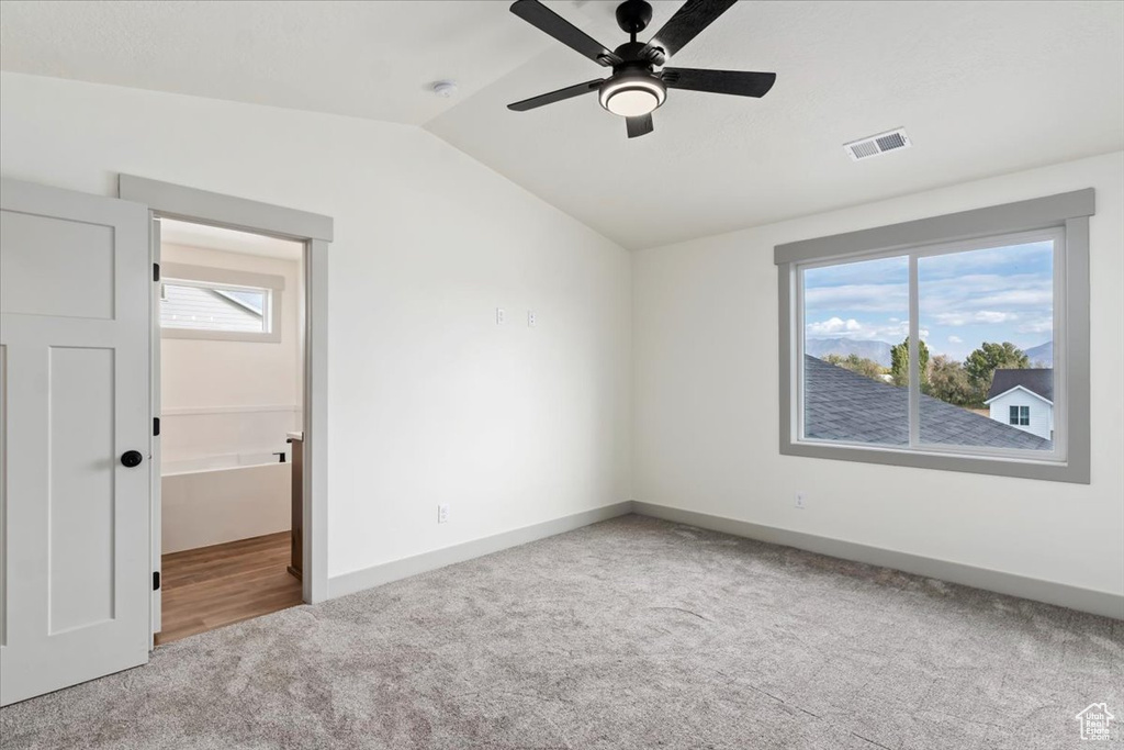 Interior space with lofted ceiling and ceiling fan