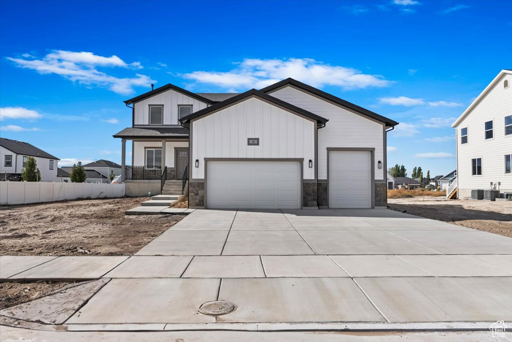 View of front of property featuring a garage