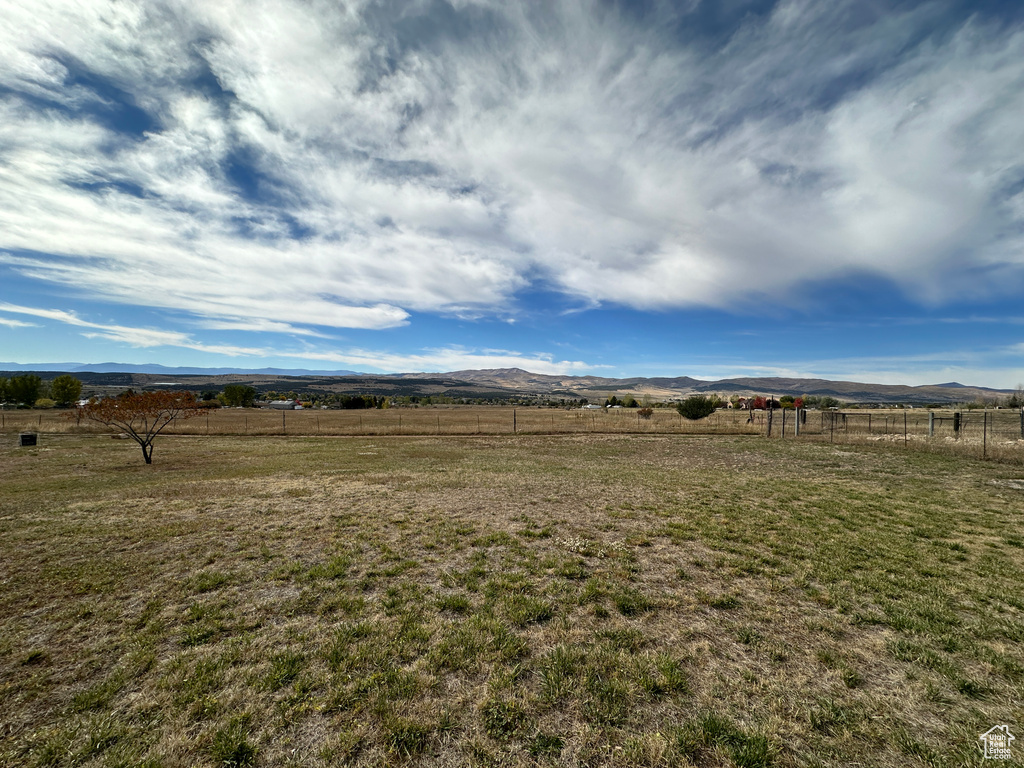 View of yard featuring a mountain view and a rural view