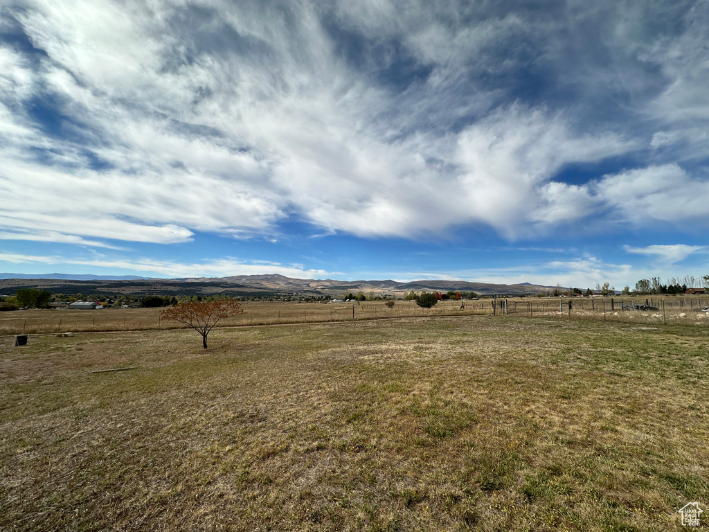 View of yard featuring a mountain view and a rural view