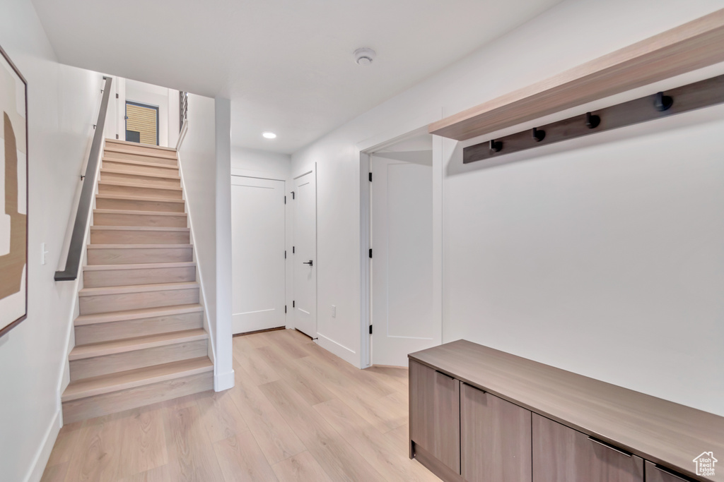 Mudroom with light hardwood / wood-style floors