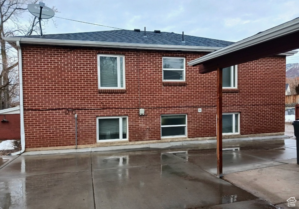 Rear view of house featuring a patio area