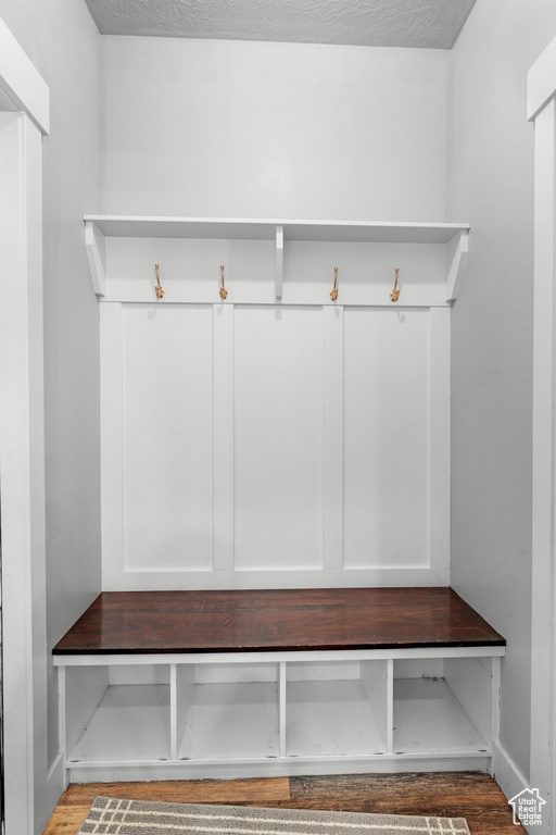 Mudroom with hardwood / wood-style flooring