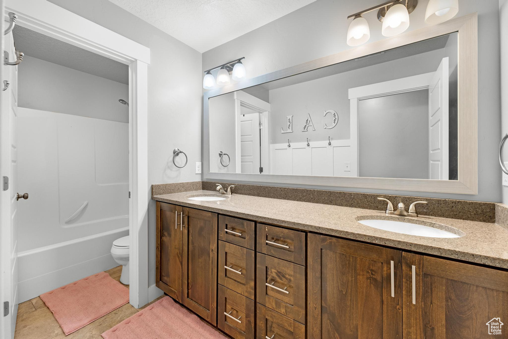 Bathroom with vanity and toilet