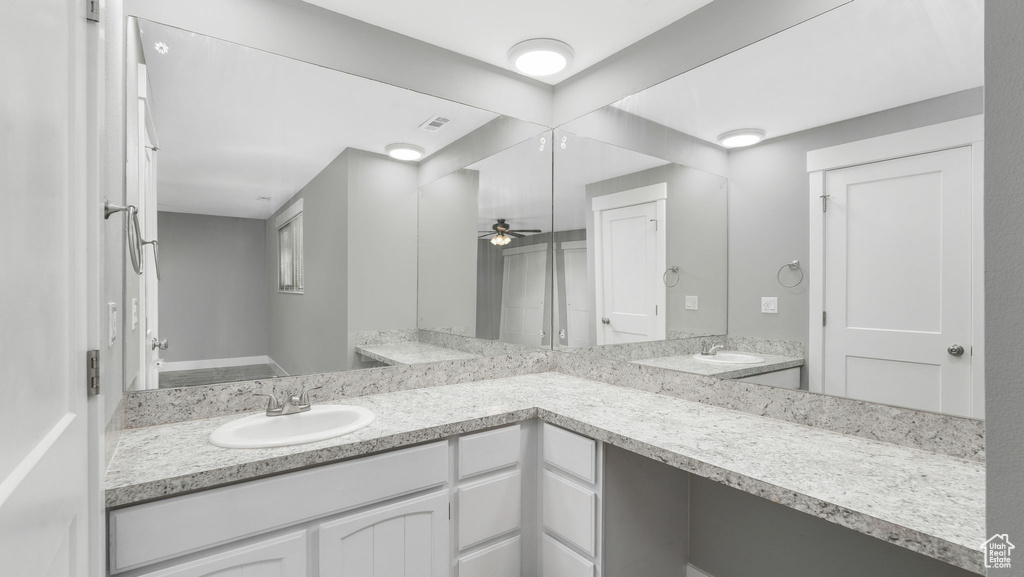 Bathroom with vanity and ceiling fan