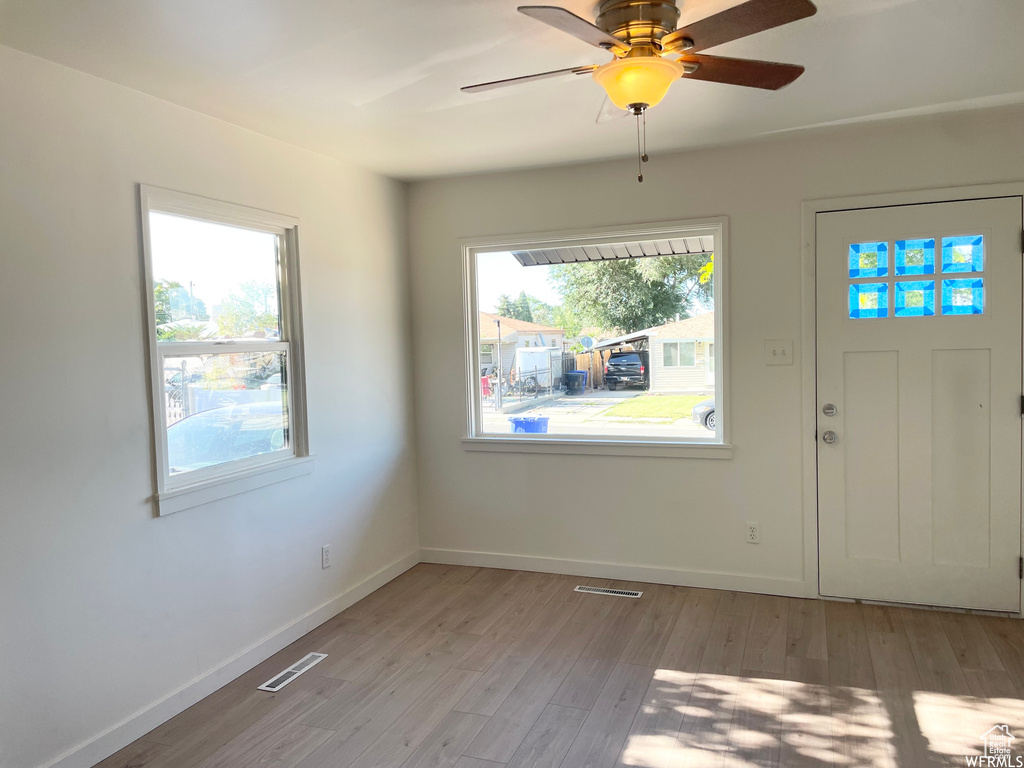 Entryway featuring light hardwood / wood-style floors and ceiling fan