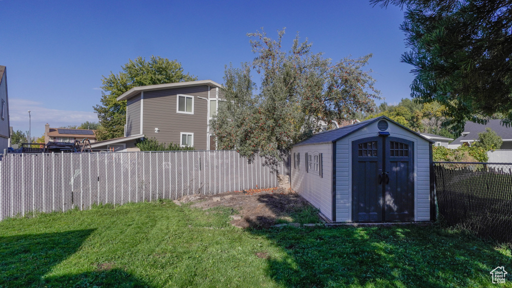 View of yard featuring a storage unit