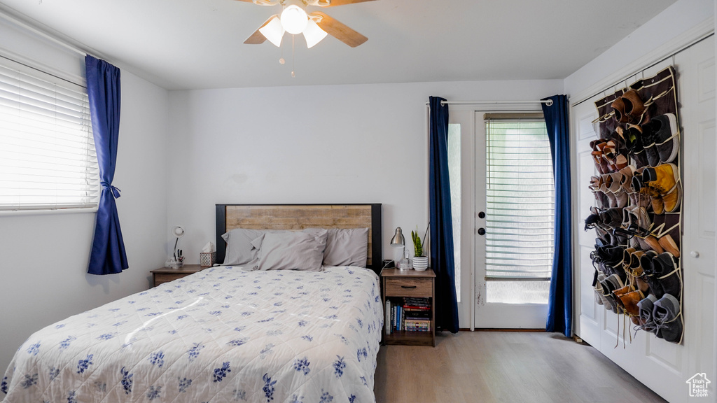 Bedroom featuring light hardwood / wood-style floors and ceiling fan