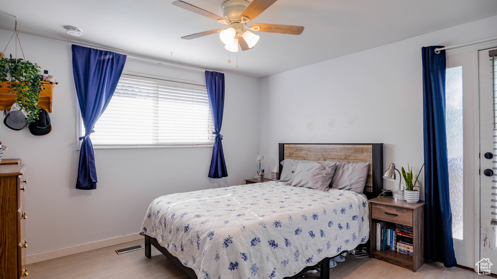 Bedroom with light wood-type flooring and ceiling fan