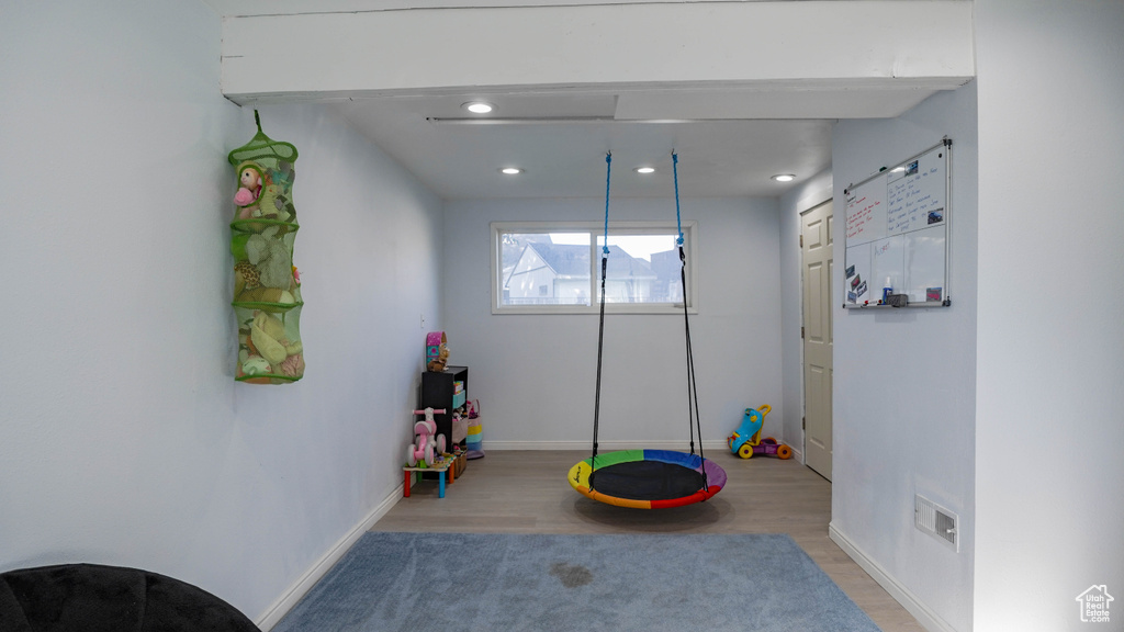 Game room featuring hardwood / wood-style flooring