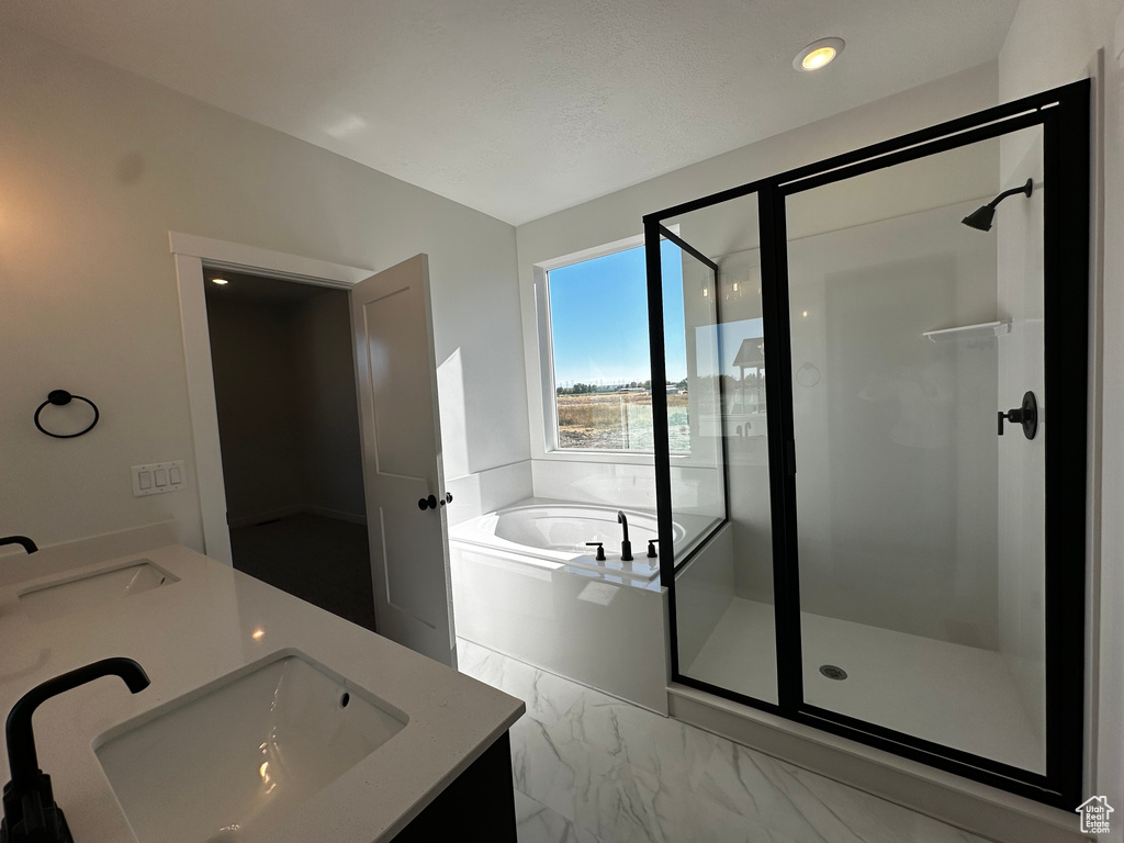 Bathroom with vanity and plus walk in shower