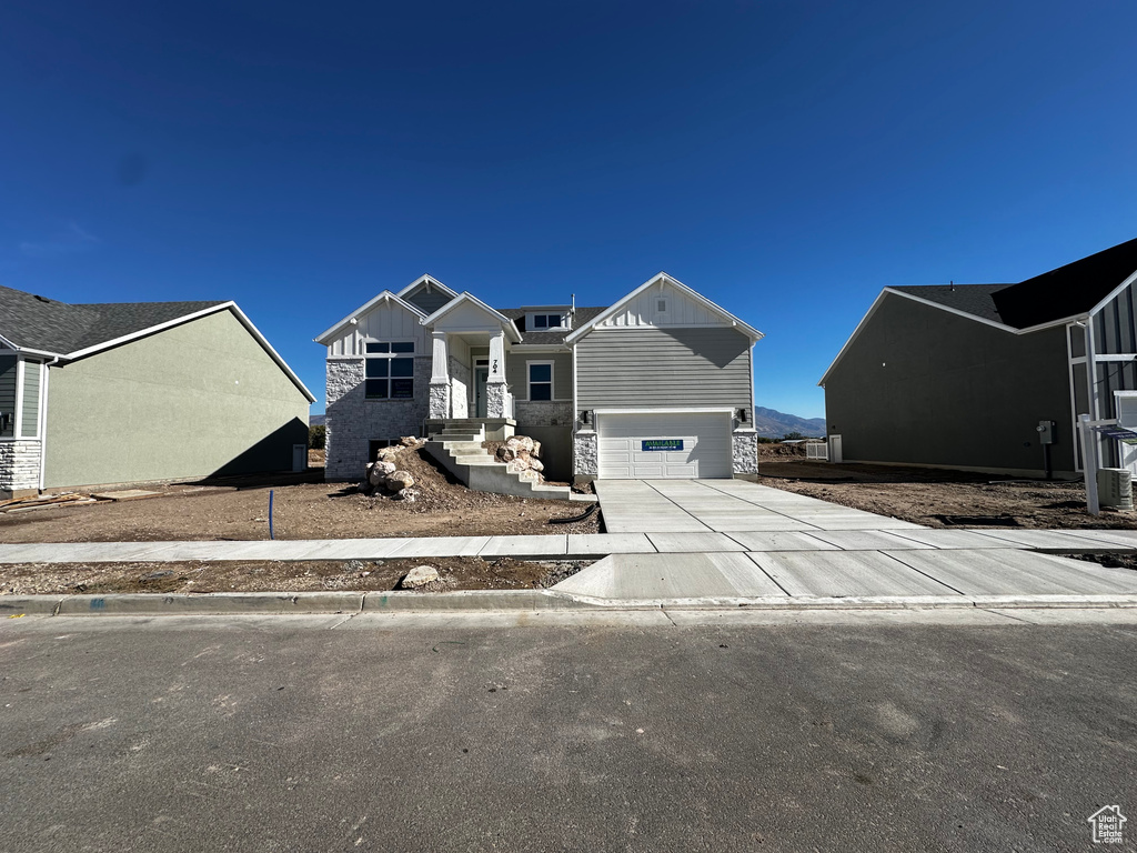 View of front of property featuring a garage