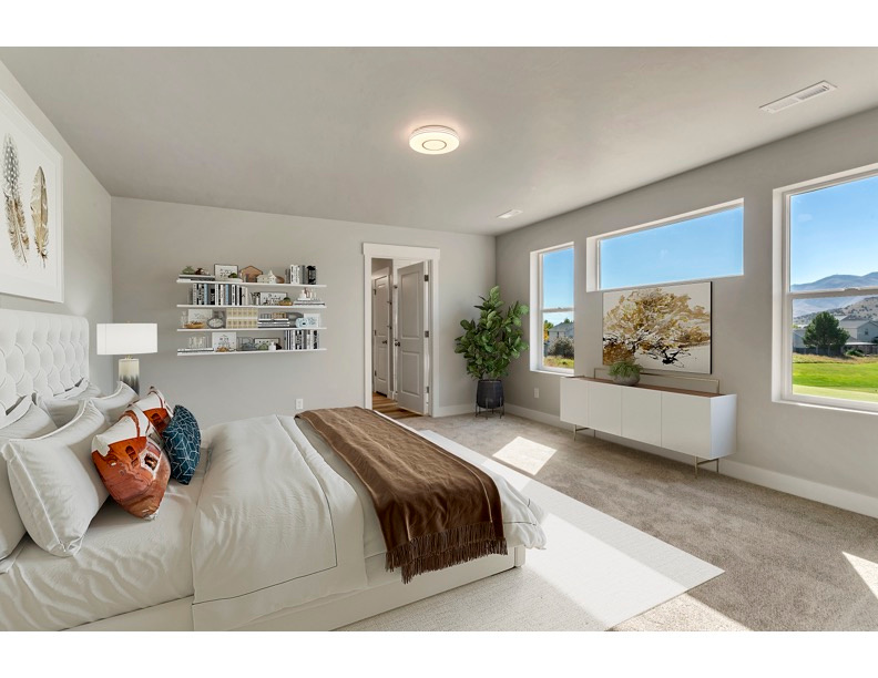 Bedroom with a mountain view and light colored carpet