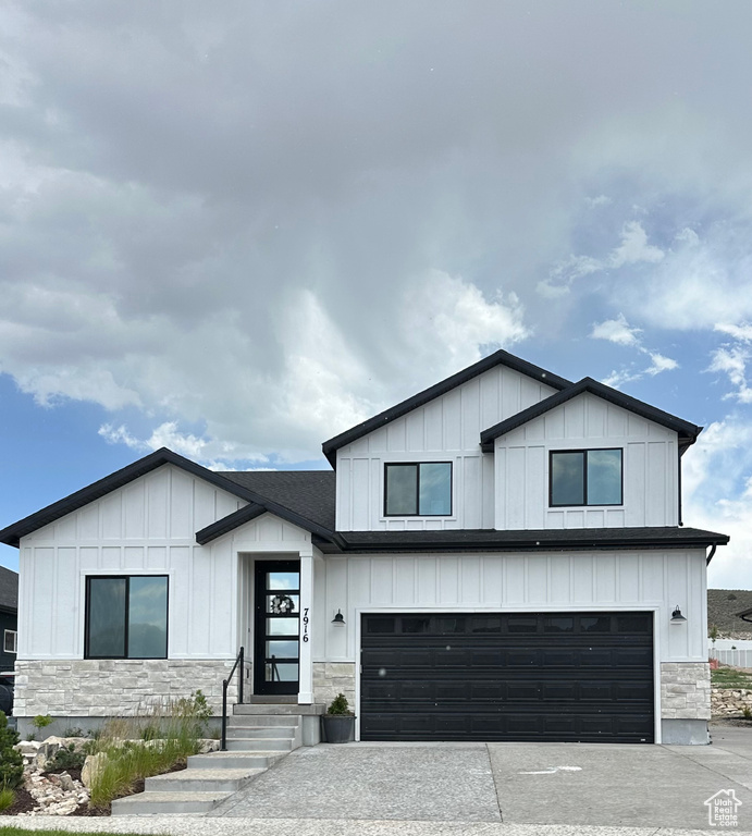 Modern farmhouse style home with a garage